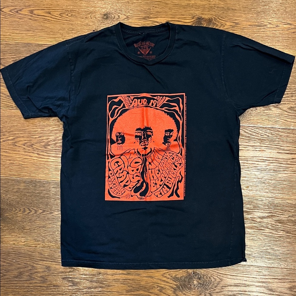 Vintage Black Graphic Tee with Orange Design